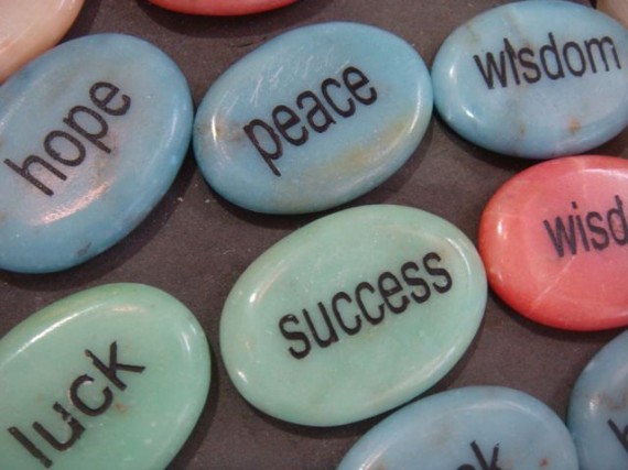 inspiring words on small stones in airport gift shop