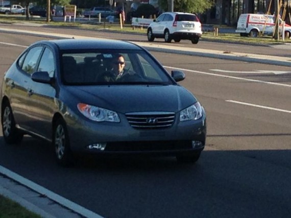 man driving to work in morning commute.