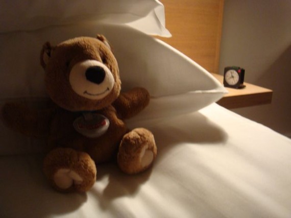 Teddy Bear tucked in bed