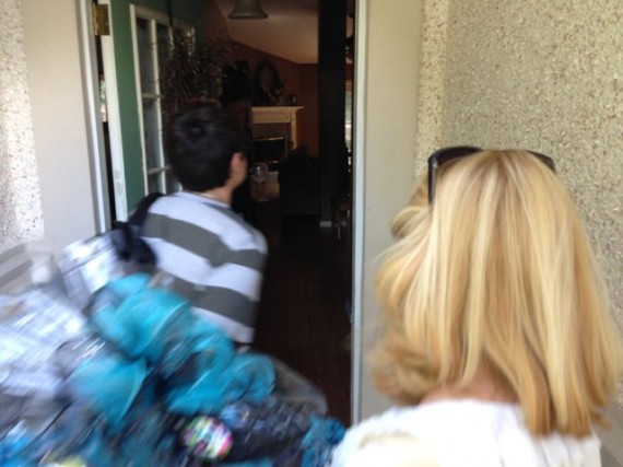 Two people walking through a door