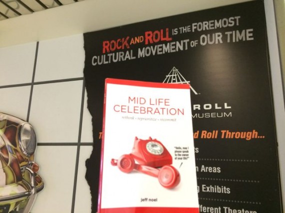 Mid Life Celebration book and Rock and Roll Hall of Fame marque
