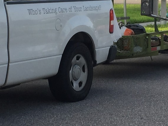 Landscaping company tag line on van