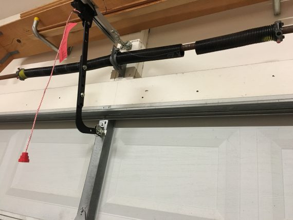 Broken garage door opened springs