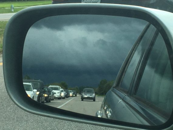 stormy weather in side view mirror